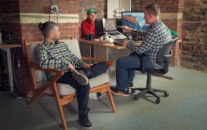 Employees collaborating at desk