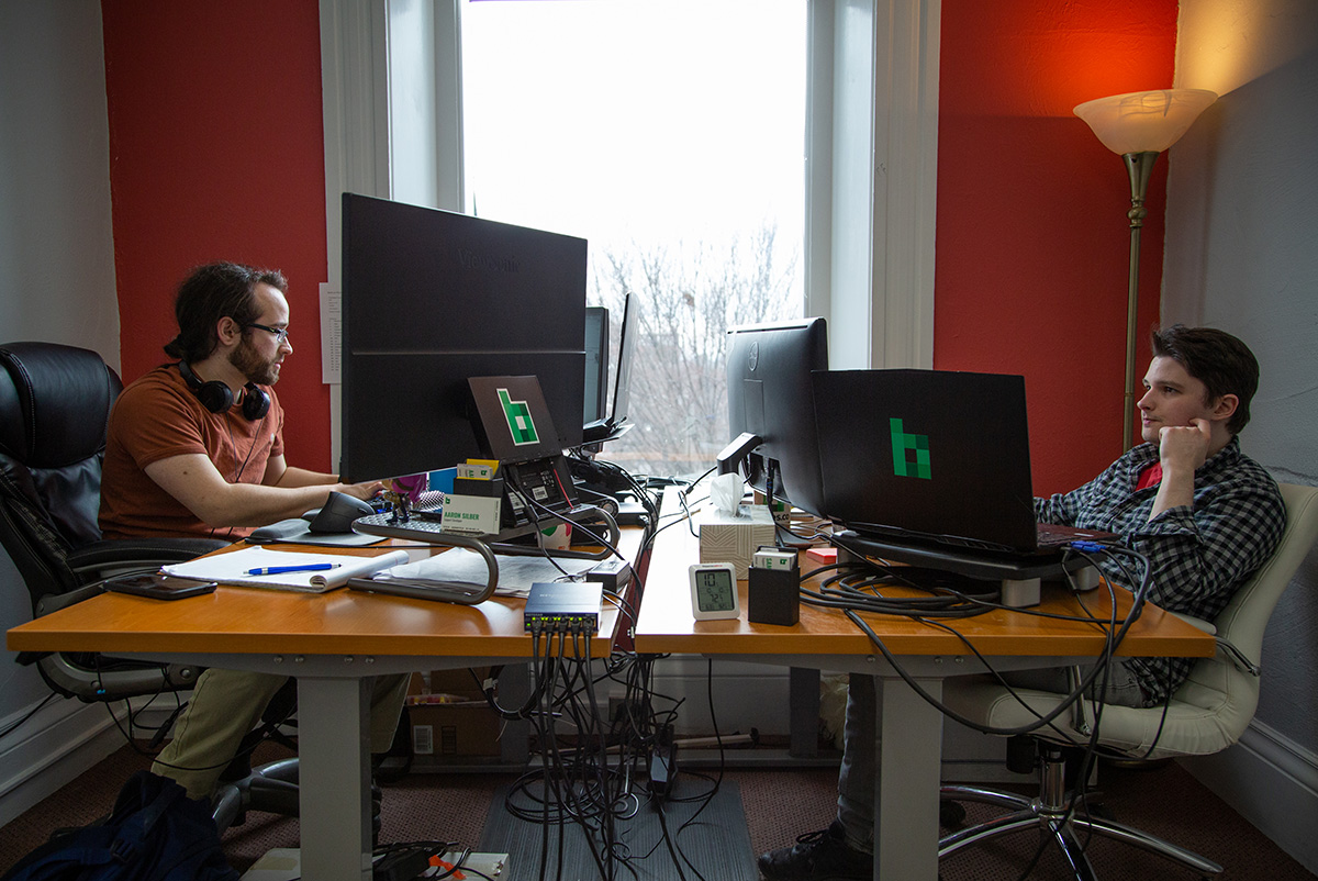 Aaron and Sam hard at work in the office