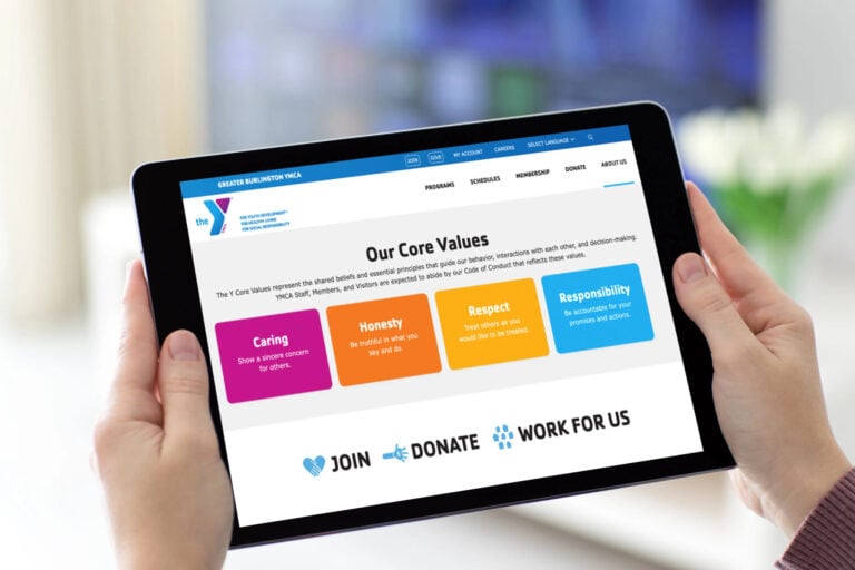 Greater Burlington YMCA Donation page on iPad. iPad is being held by two hands.
