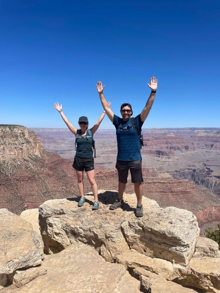 Sarah and her husband in front of a canyon