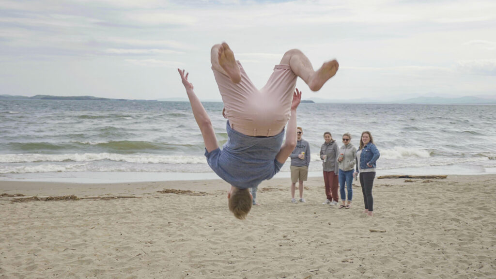 Person doing a flip on the beach