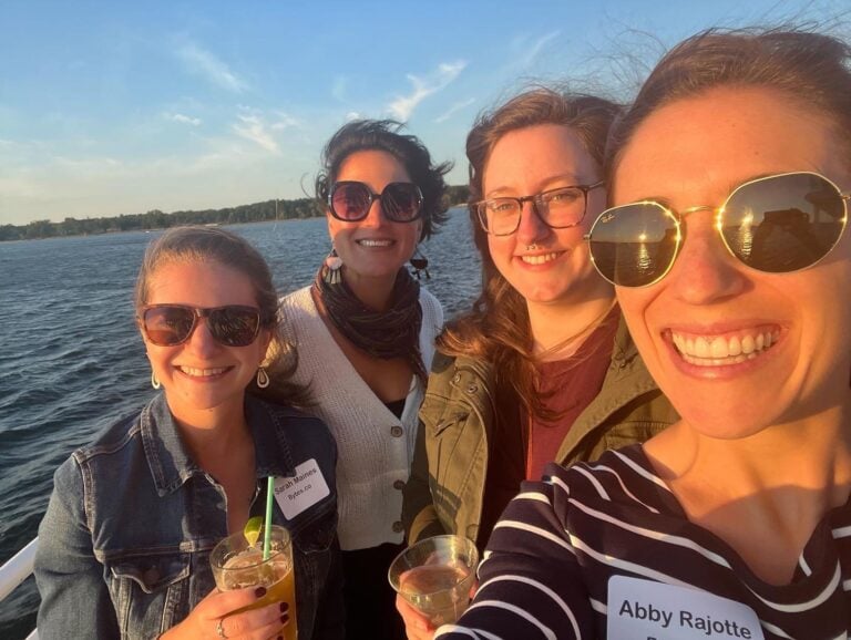 Kristina and other members of the Bytes team take a selfie at sunset while on the Spirit of Ethan Allen boat