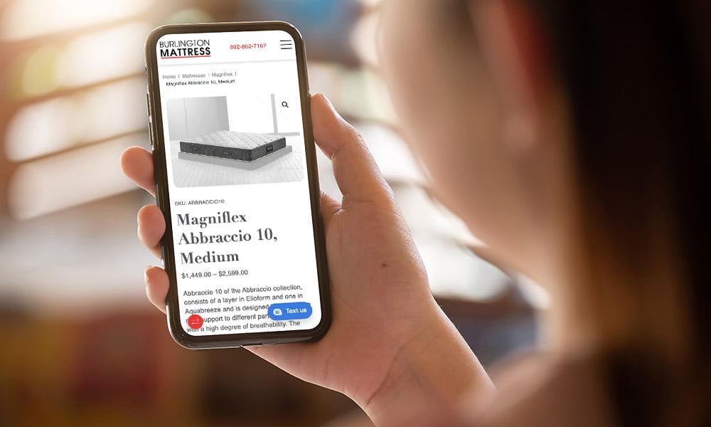 Phone displaying the homepage of Burlington Mattress