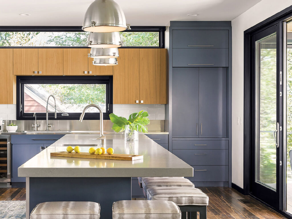 Interior view of a modern day kitchen with bright, contemporary windows and a sliding glass door