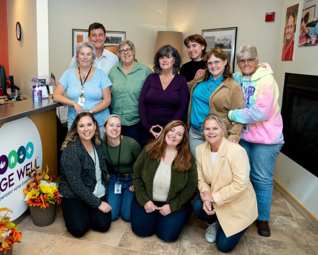 Age Well team members gathered together for a group photo in the office