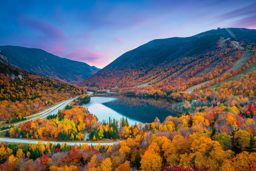 A mountain and lake in Franconia Notch State Park in New Hampshire in fall