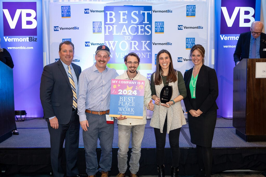 Bytes.co team members accepting a 2024 Best Places to Work in Vermont award