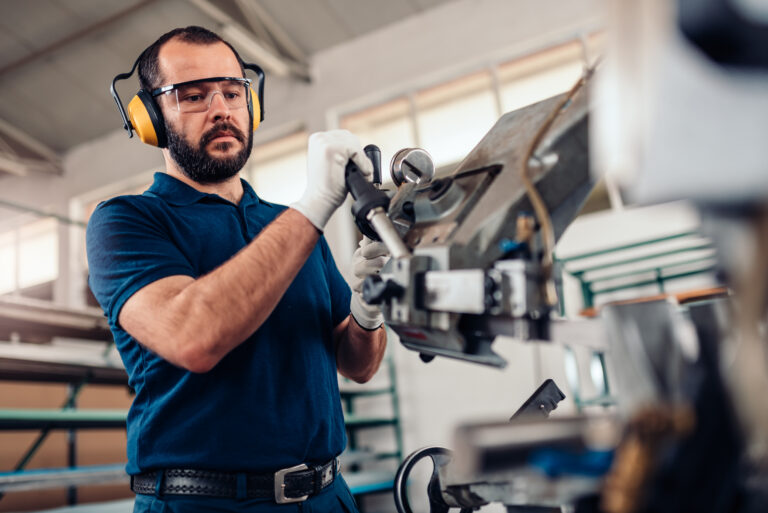 Man using a machine in a factory