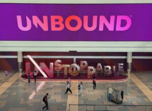 Unbound banner with a sculpture reading Unstoppable underneath it