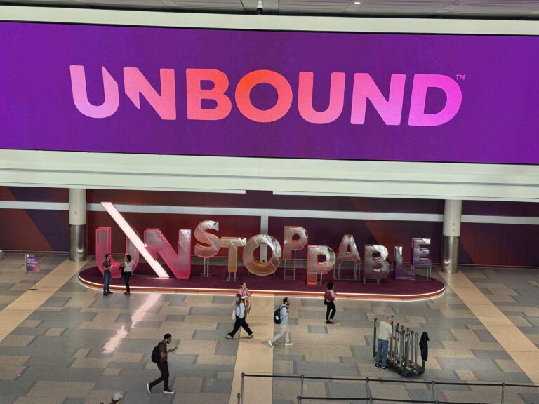 Unbound banner with a sculpture reading Unstoppable underneath it