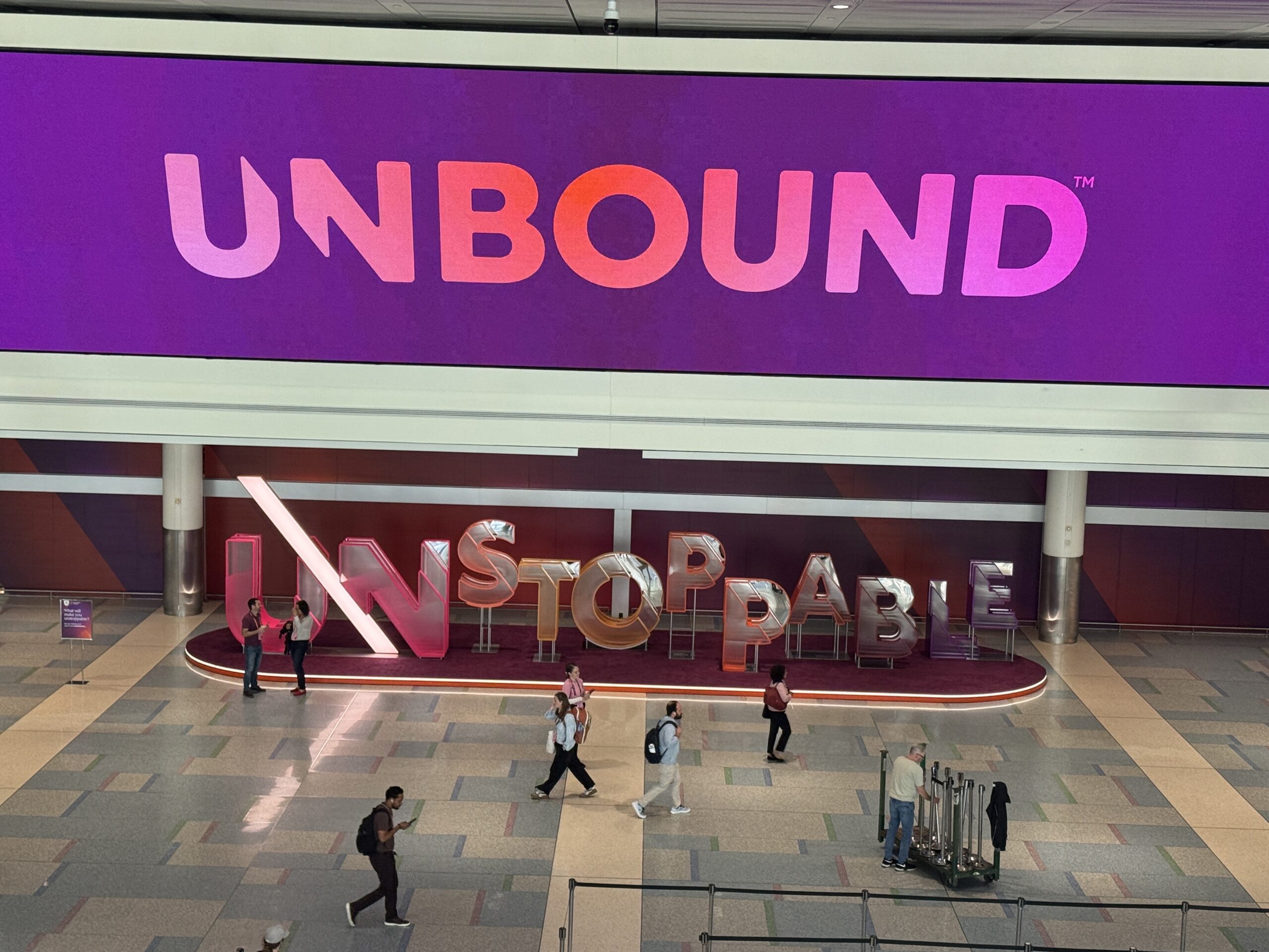 Unbound banner with a sculpture reading Unstoppable underneath it